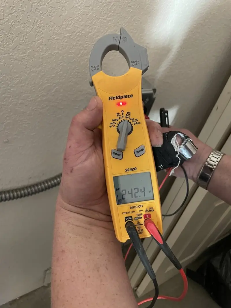 Voltage testing with clamp meter during Hot Tub / Pool Electrical Wiring in Douglass